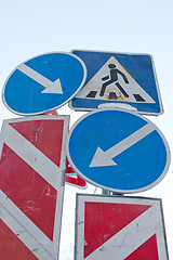 Image showing traffic signs conflict