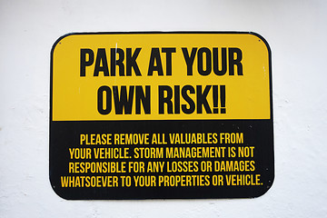 Image showing Park at your own risk sign