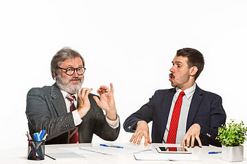 Image showing The two colleagues working together at office on white background.