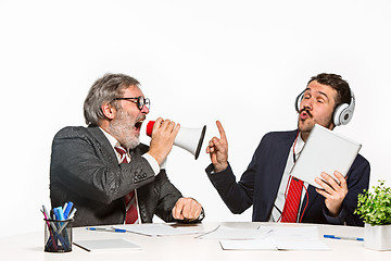 Image showing The two colleagues working together at office on white background.