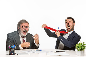 Image showing The two colleagues working together at office on white background.