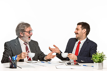 Image showing The two colleagues working together at office on white background.