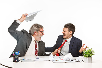 Image showing The two colleagues working together at office on white background.