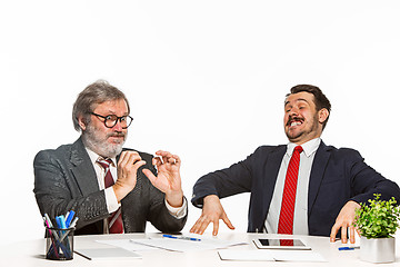 Image showing The two colleagues working together at office on white background.