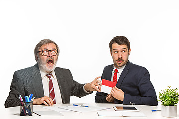 Image showing Concept - corruption. Businessman in a suit taking a bribe