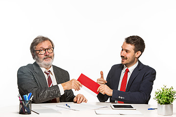 Image showing Concept - corruption. Businessman in a suit taking a bribe