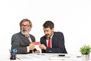 Image showing Concept - corruption. Businessman in a suit taking a bribe