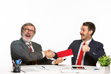 Image showing Concept - corruption. Businessman in a suit taking a bribe