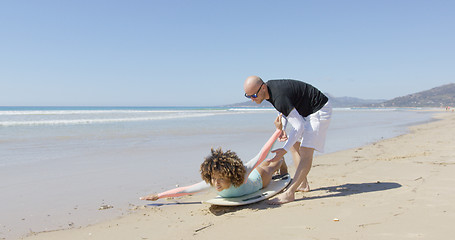 Image showing The instructor with female surfer