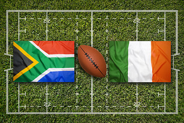 Image showing South Africa vs. Ireland flags on rugby field
