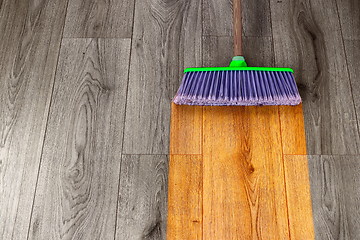 Image showing sweeping out wooden parquet