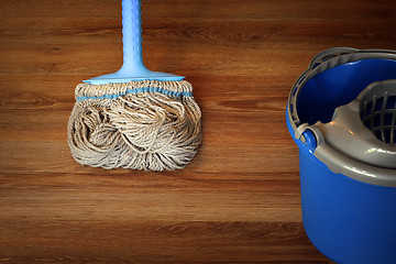 Image showing cleaning equipment on wooden floor