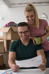 Image showing Young couple moving in a new home