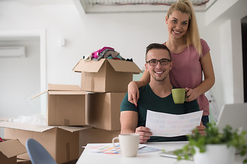 Image showing Young couple moving in a new home