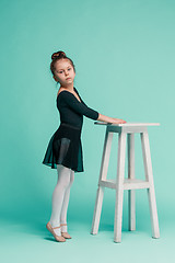 Image showing The little balerina dancer on blue background