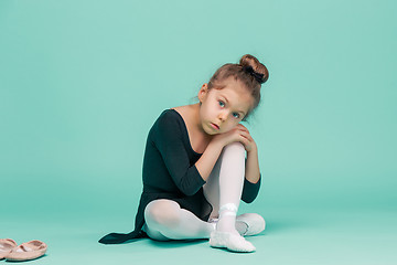 Image showing The little balerina dancer on blue background