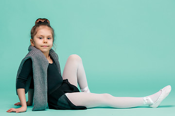 Image showing The little balerina dancer on blue background