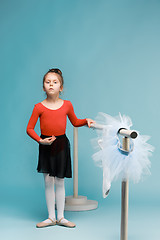 Image showing The little balerina dancer on blue background