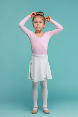 Image showing The little balerina dancer on blue background