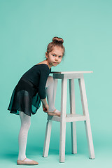 Image showing The little balerina dancer on blue background