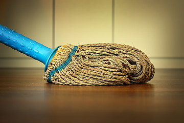 Image showing plastic mop on wooden floor