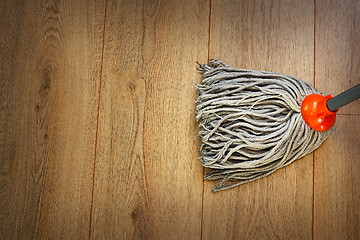 Image showing detail of a mop on wooden parquet