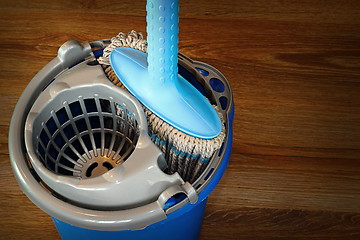 Image showing mop and blue bucket ready for cleaning floor