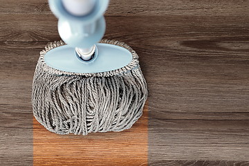 Image showing washing wood floor with mop