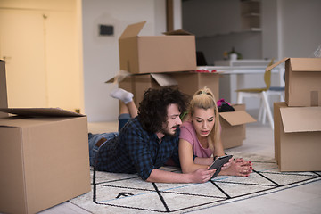 Image showing Young couple moving in a new flat