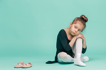 Image showing The little balerina dancer on blue background