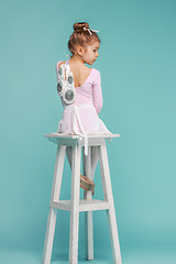 Image showing The little balerina dancer on blue background