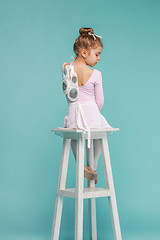 Image showing The little balerina dancer on blue background