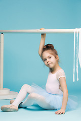 Image showing The little balerina dancer on blue background