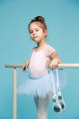 Image showing The little balerina dancer on blue background