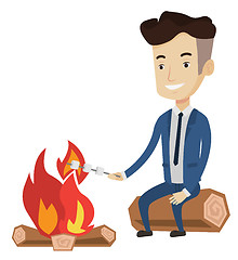 Image showing Businessman roasting marshmallow over campfire.