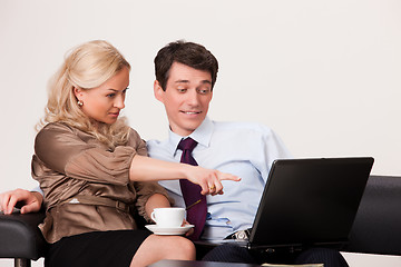 Image showing Young Woman And Man with a notebook