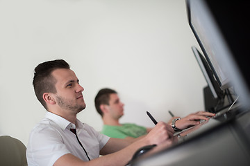 Image showing a group of graphic designers at work