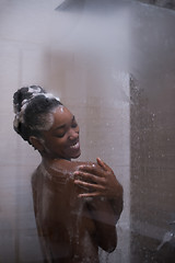 Image showing African American woman in the shower