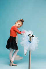 Image showing The little balerina dancer on blue background