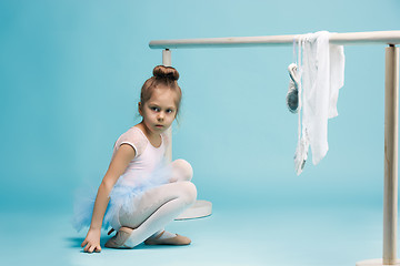 Image showing The little balerina dancer on blue background