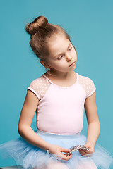 Image showing The little balerina dancer on blue background