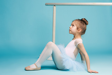 Image showing The little balerina dancer on blue background