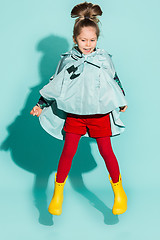 Image showing Little girl posing in fashion style wearing autumn clothing.