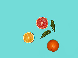 Image showing The group fresh fruits against blue background