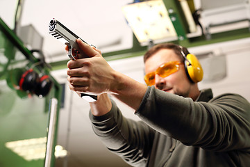 Image showing Gun. Sport shooting range. The man at the shooting range.