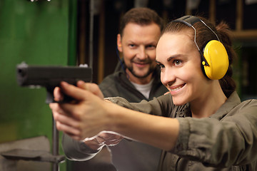 Image showing Relax on the shooting, a woman shot with a Glock.