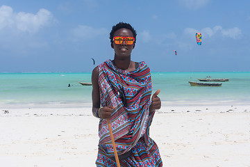 Image showing Traditonaly dressed black man on Paje beach, Zanzibar, Tanzania, East Africa.