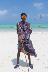 Image showing Traditonaly dressed black man on Paje beach, Zanzibar.