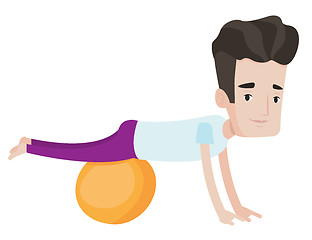 Image showing Young man exercising with fitball.