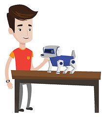 Image showing Happy young man playing with robotic dog.